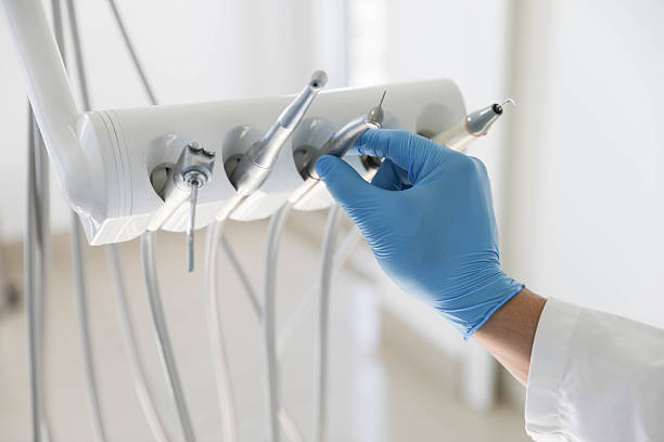 Professional Emergency Dentist technician working in Groves, TX